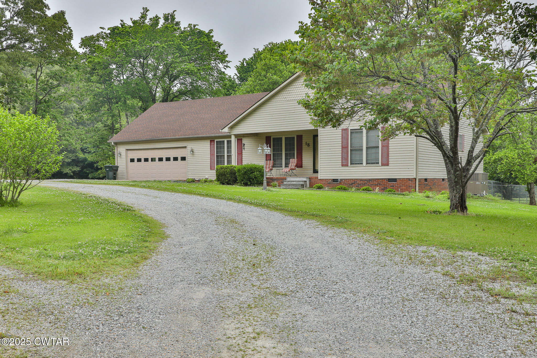 18 Tollie Markham Road Dyer, TN 38330 - Photo 25 of 27 a front view of a house with a garden and trees