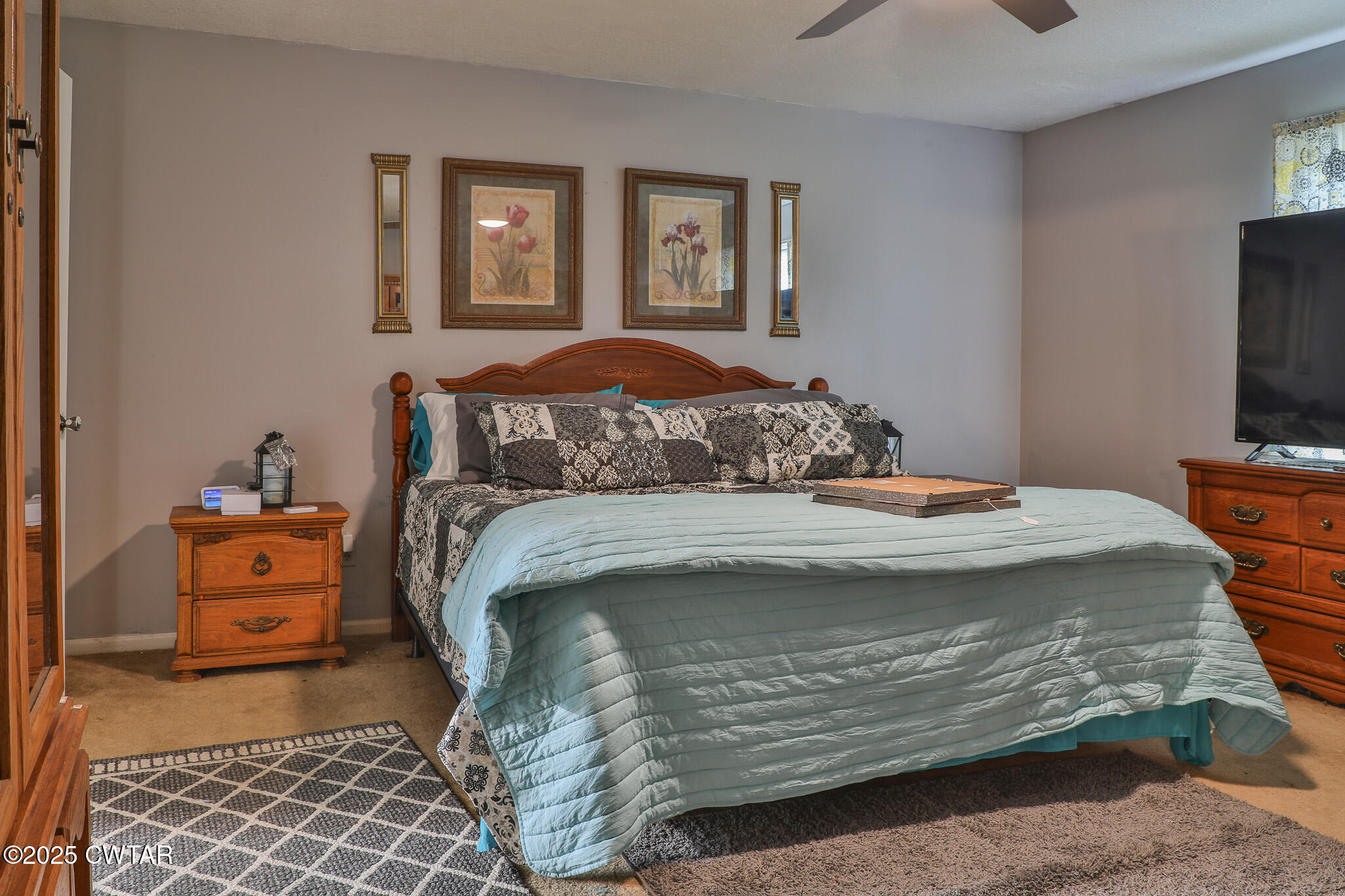 18 Tollie Markham Road Dyer, TN 38330 - Photo 8 of 27 a bedroom with a bed and tv on the dresser