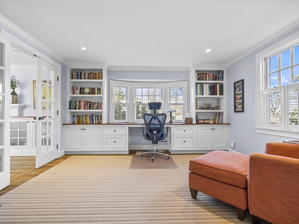 35 Lehigh Road Wellesley, MA 02482 - Photo 12 of 23 a living room with furniture hard wood floor and a book shelf