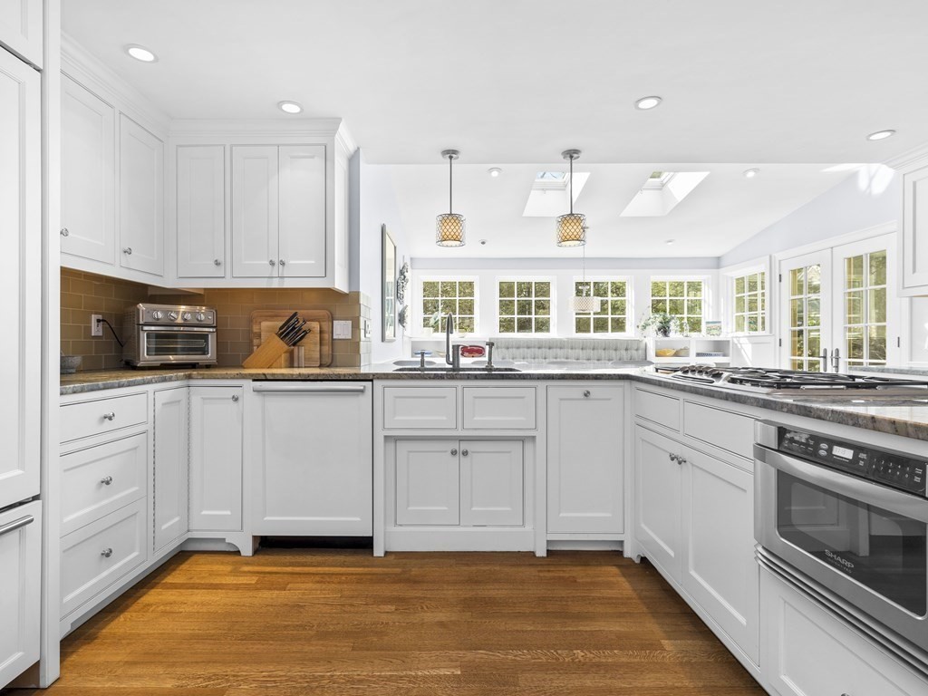 35 Lehigh Road Wellesley, MA 02482 - Photo 3 of 23 a kitchen with white cabinets and appliances
