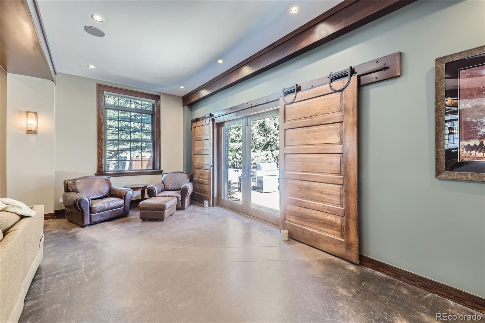 2971 Fall River Road Idaho Springs, CO 80452 - Photo 13 of 42 a living room with furniture and windows