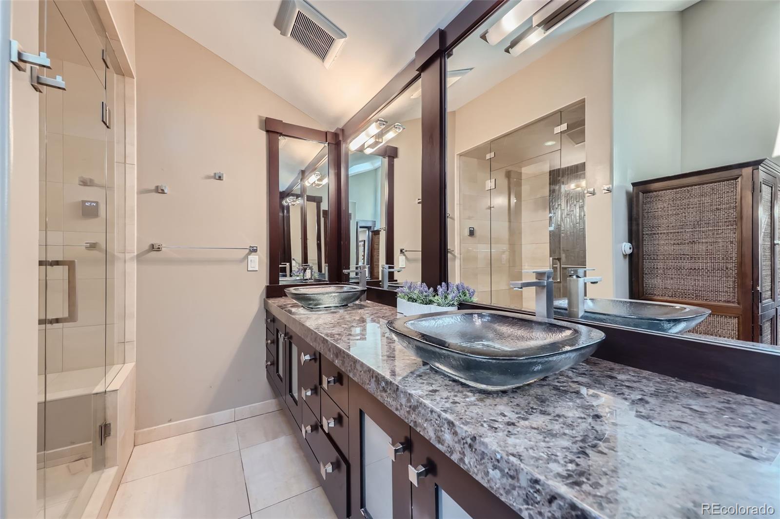 2971 Fall River Road Idaho Springs, CO 80452 - Photo 17 of 42 a spacious bathroom with a granite countertop tub sink and mirror