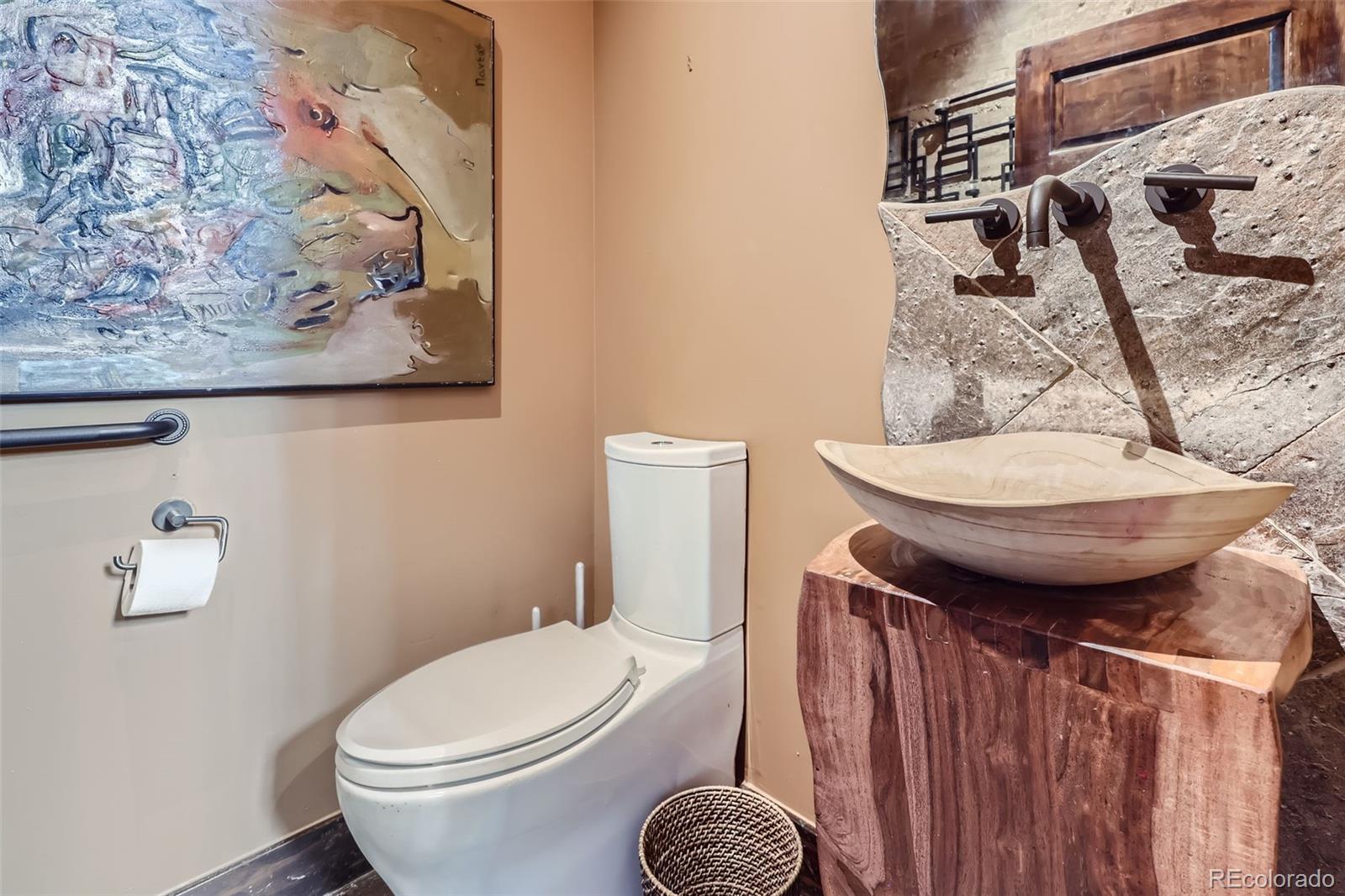 2971 Fall River Road Idaho Springs, CO 80452 - Photo 21 of 42 a bathroom with a toilet and a mirror