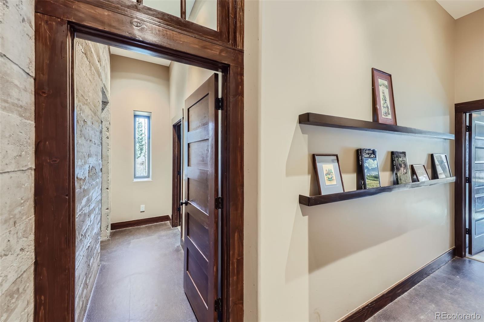 2971 Fall River Road Idaho Springs, CO 80452 - Photo 25 of 42 a view of a hallway with closet and wooden floor