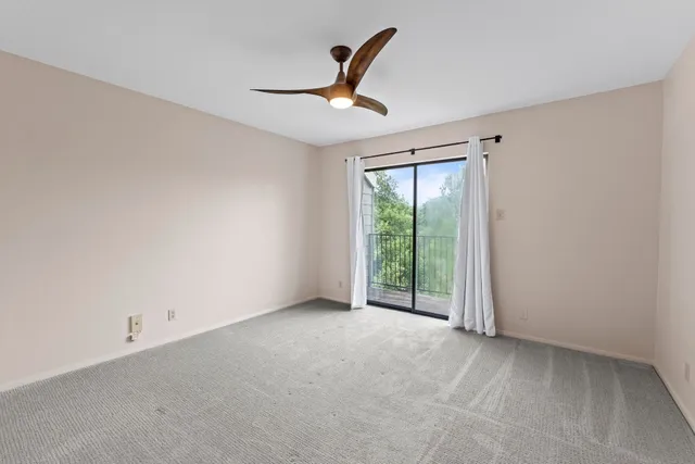 a bathroom with a granite countertop sink mirror and shower