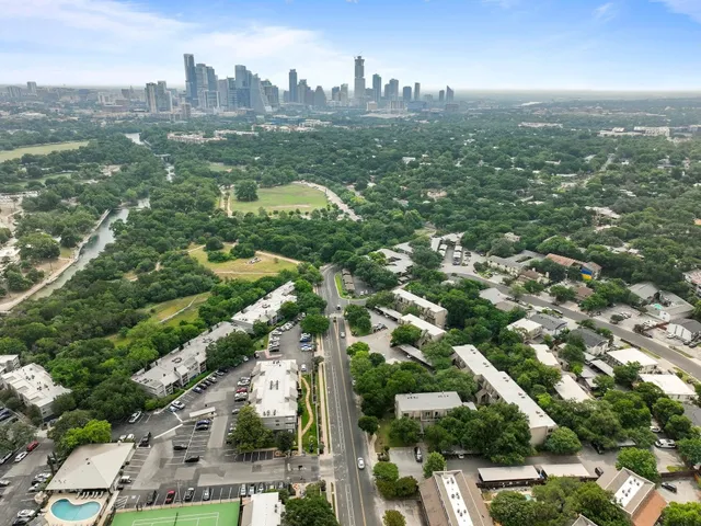 a view of a patio with a table and chairs