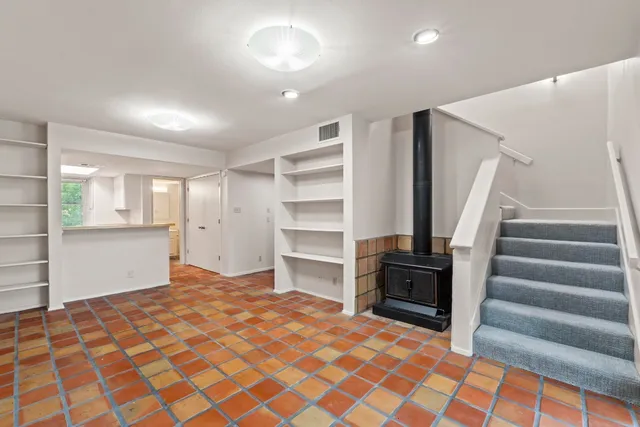 a bedroom with a bed and cabinets