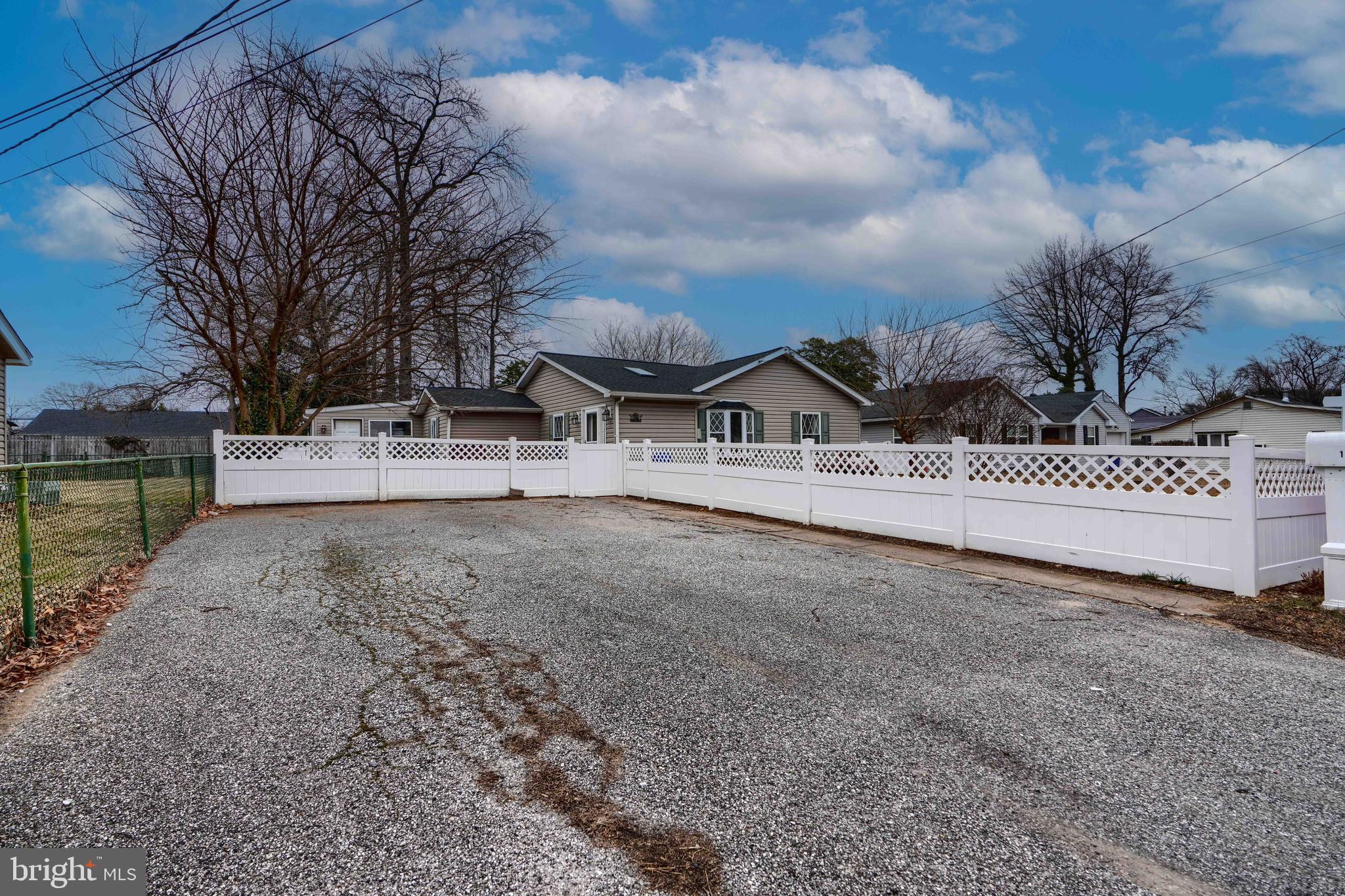 1309 3rd Road Baltimore, MD 21220 - Photo 4 of 38 a view of white house with a yard