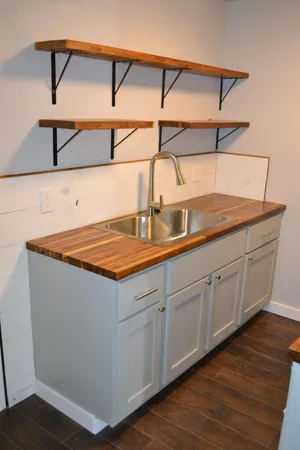 a kitchen with a sink and cabinets