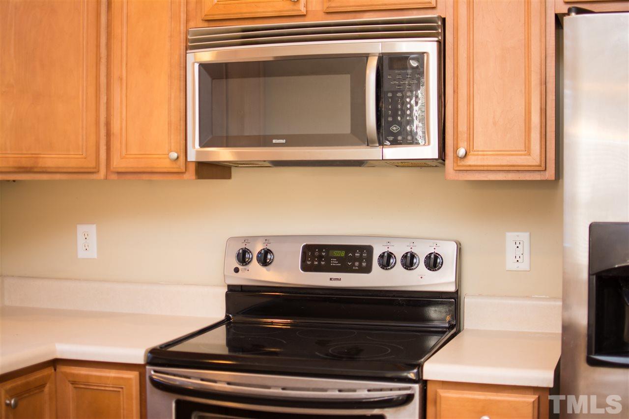 2605 Andover Glen Road Raleigh, NC 27604 - Photo 9 of 17 a stove top oven sitting inside of a kitchen