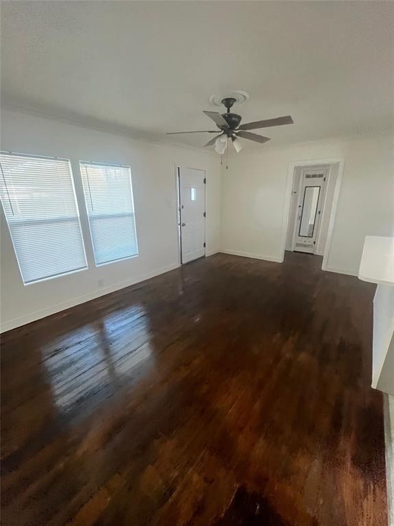 210 Clyde Street Abilene, TX 79605 - Photo 6 of 15 a view of empty room with wooden floor and fan