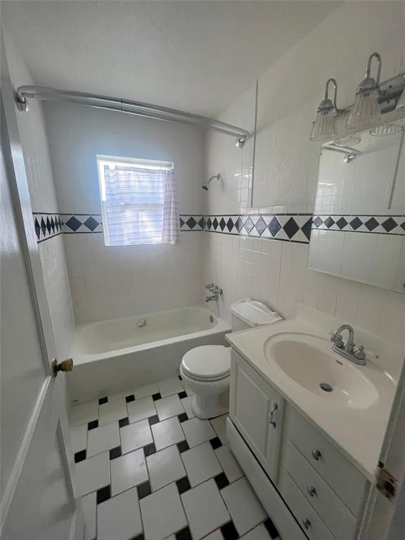 210 Clyde Street Abilene, TX 79605 - Photo 10 of 15 a bathroom with a sink toilet and shower