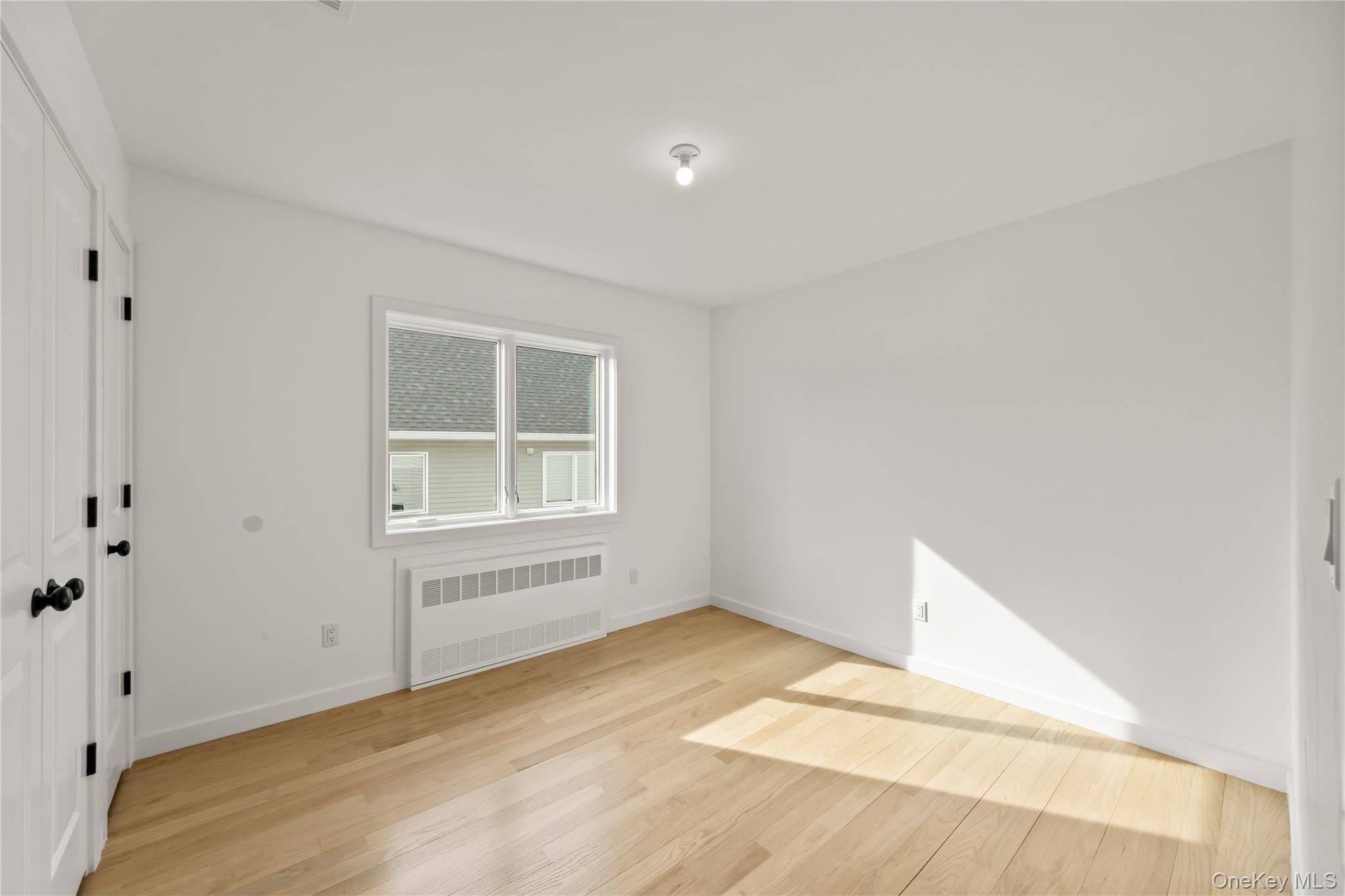 23 Singer Avenue, Unit 211 Spring Valley, NY 10977 - Photo 30 of 45 a view of an empty room with a window