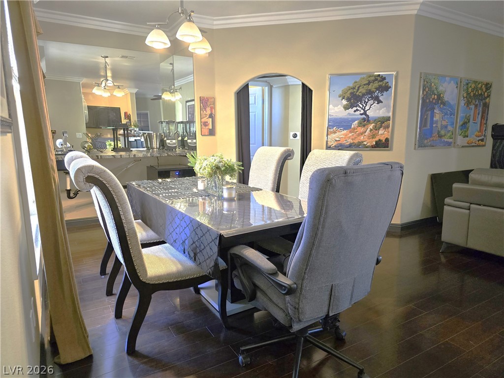 2050 West Warm Springs Road, Unit 2422 Henderson, NV 89014 - Photo 12 of 44 This inviting dining area features elegant crown molding and rich hardwood flooring.