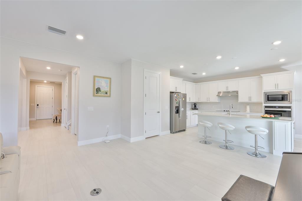 16320 Hidden Oak Loop Bradenton, FL 34211 - Photo 12 of 56 a view of kitchen with stainless steel appliances refrigerator stove microwave and cabinets