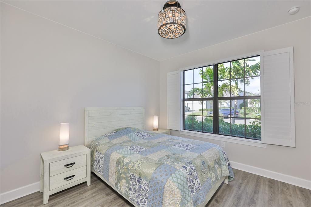 16320 Hidden Oak Loop Bradenton, FL 34211 - Photo 24 of 56 a bedroom with a bed and a window