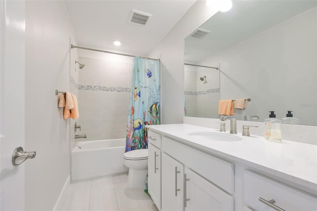 16320 Hidden Oak Loop Bradenton, FL 34211 - Photo 33 of 56 a bathroom with a tub sink toilet and a mirror