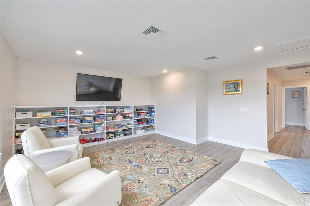 16320 Hidden Oak Loop Bradenton, FL 34211 - Photo 38 of 56 a living room with furniture and a flat screen tv