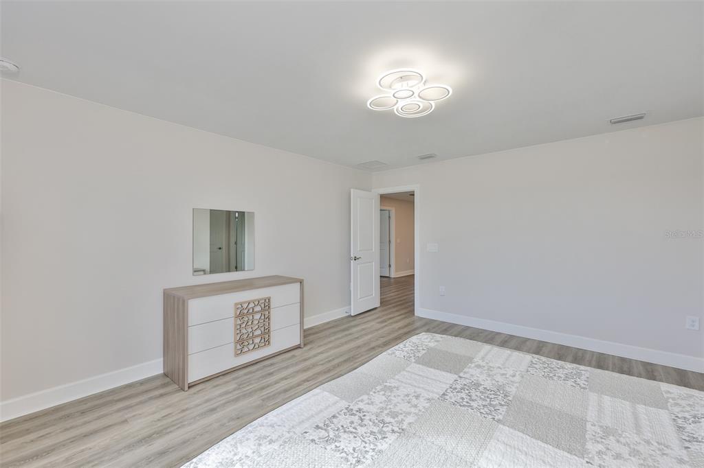 16320 Hidden Oak Loop Bradenton, FL 34211 - Photo 41 of 56 a view of a hallway with wooden floor
