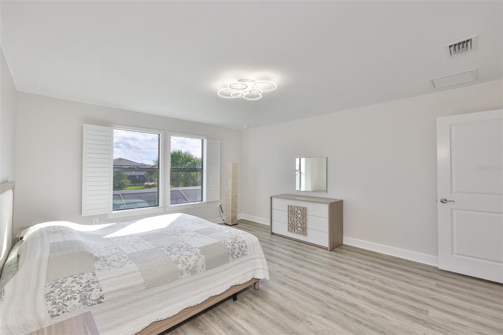 16320 Hidden Oak Loop Bradenton, FL 34211 - Photo 42 of 56 a large white bed in a white room