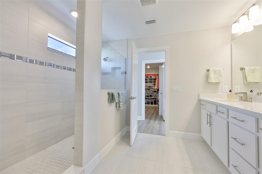 16320 Hidden Oak Loop Bradenton, FL 34211 - Photo 43 of 56 a spacious bathroom with a shower and a sink