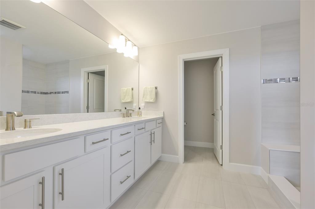 16320 Hidden Oak Loop Bradenton, FL 34211 - Photo 44 of 56 a spacious bathroom with 2 sink and a mirror