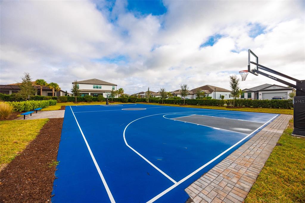 16320 Hidden Oak Loop Bradenton, FL 34211 - Photo 55 of 56 a view of a tennis court with sitting area
