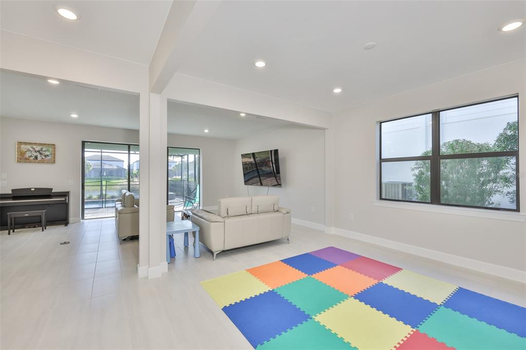16320 Hidden Oak Loop Bradenton, FL 34211 - Photo 7 of 56 a living room with furniture and a rug
