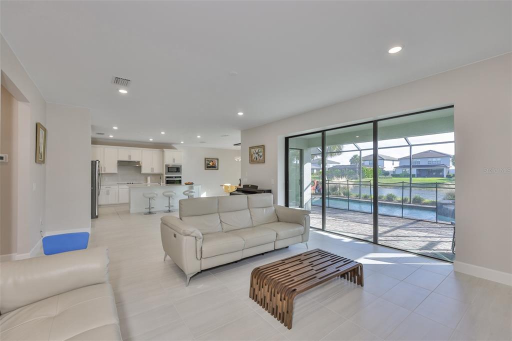16320 Hidden Oak Loop Bradenton, FL 34211 - Photo 8 of 56 a living room with furniture and a large window