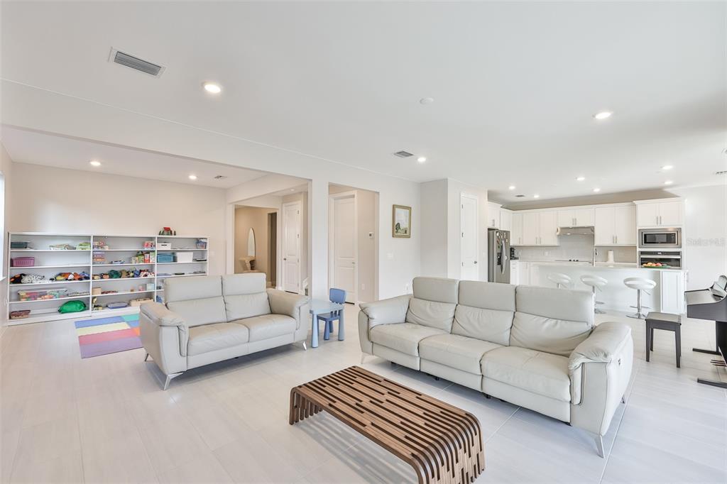 16320 Hidden Oak Loop Bradenton, FL 34211 - Photo 10 of 56 a living room with furniture and view of kitchen