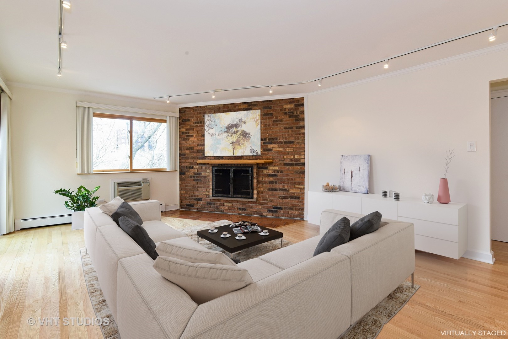 401 West Webster Avenue, Unit 502 Chicago, IL 60614 - Photo 2 of 12 a living room with furniture and a fireplace