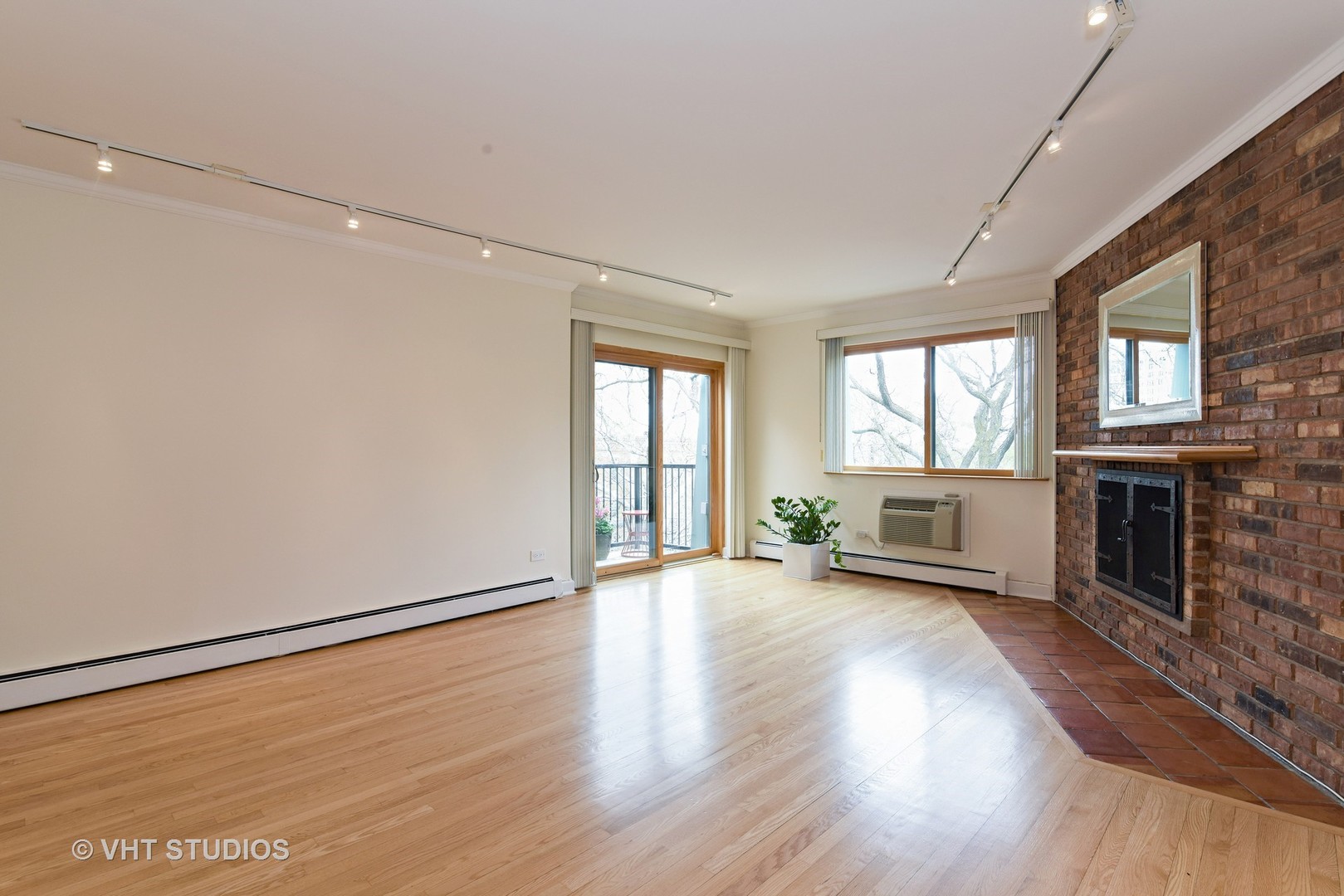 401 West Webster Avenue, Unit 502 Chicago, IL 60614 - Photo 3 of 12 wooden floor in an empty room with a window