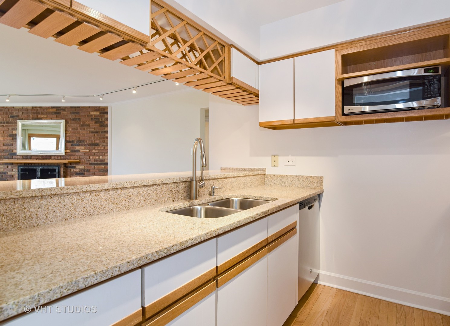 401 West Webster Avenue, Unit 502 Chicago, IL 60614 - Photo 4 of 12 a kitchen with a sink and cabinets