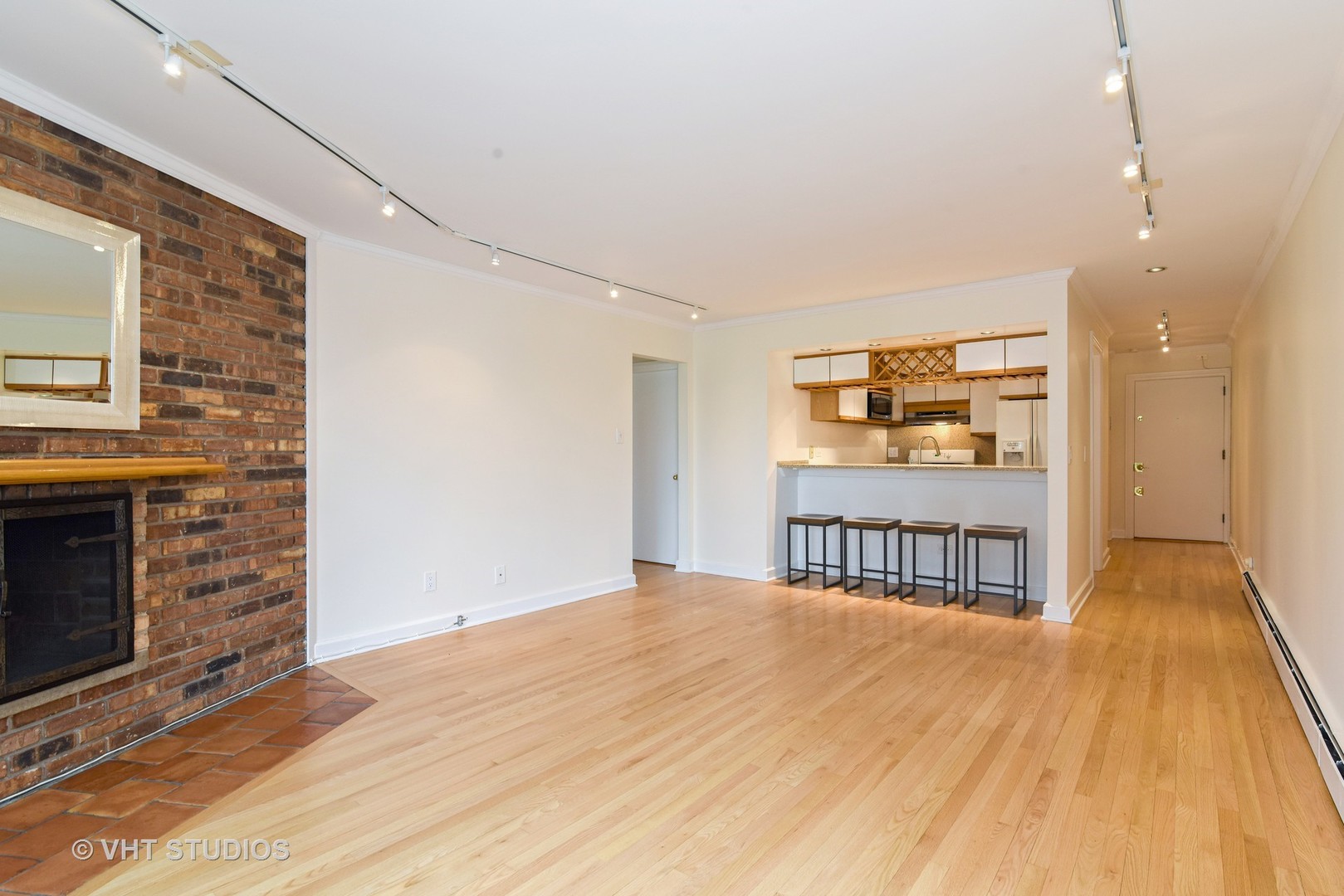 401 West Webster Avenue, Unit 502 Chicago, IL 60614 - Photo 5 of 12 a view of a room with wooden floor and kitchen space