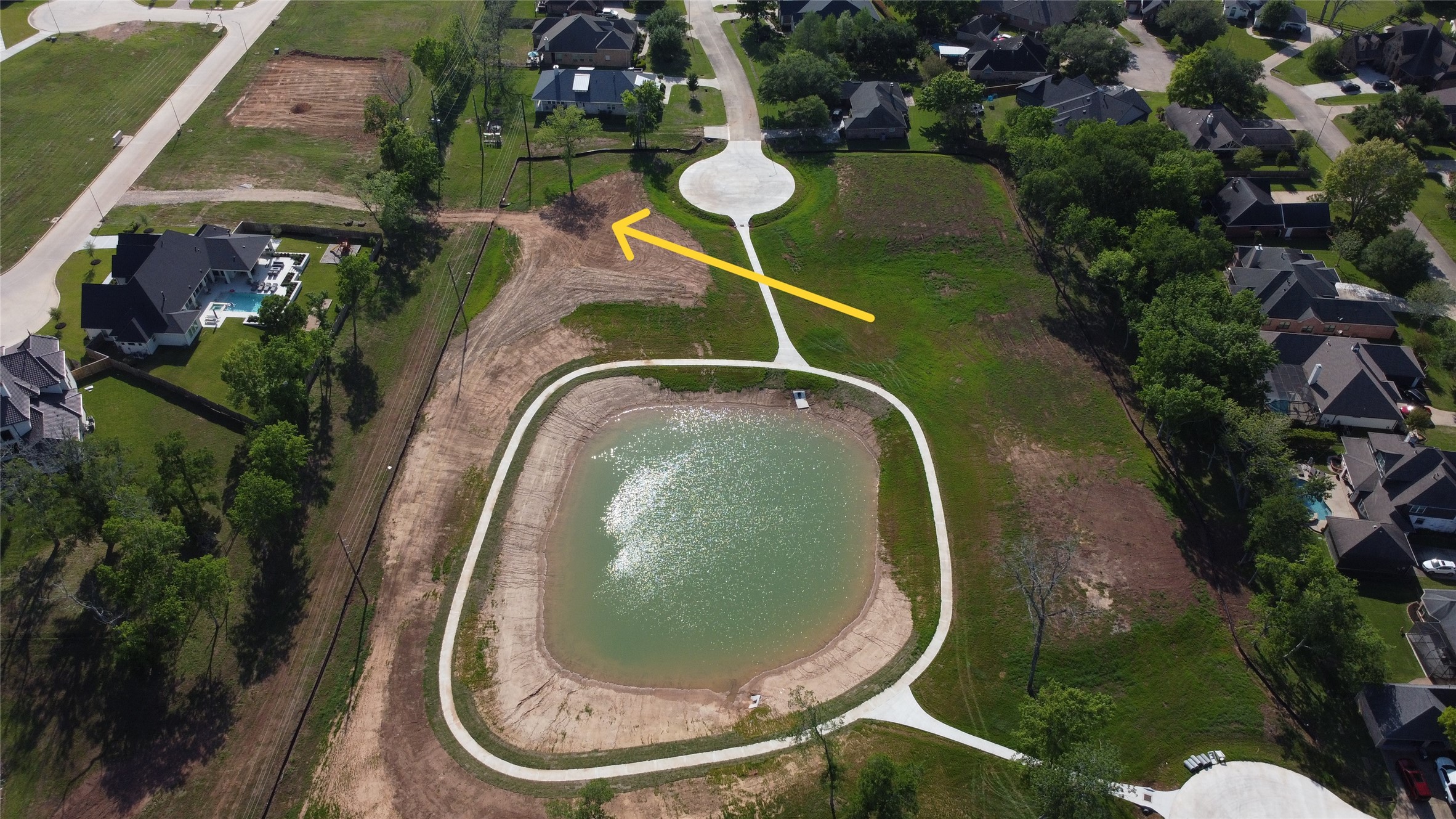 33201 Worthing Lane Fulshear, TX 77441 - Photo 2 of 8 an aerial view of a house with swimming pool and trees all around
