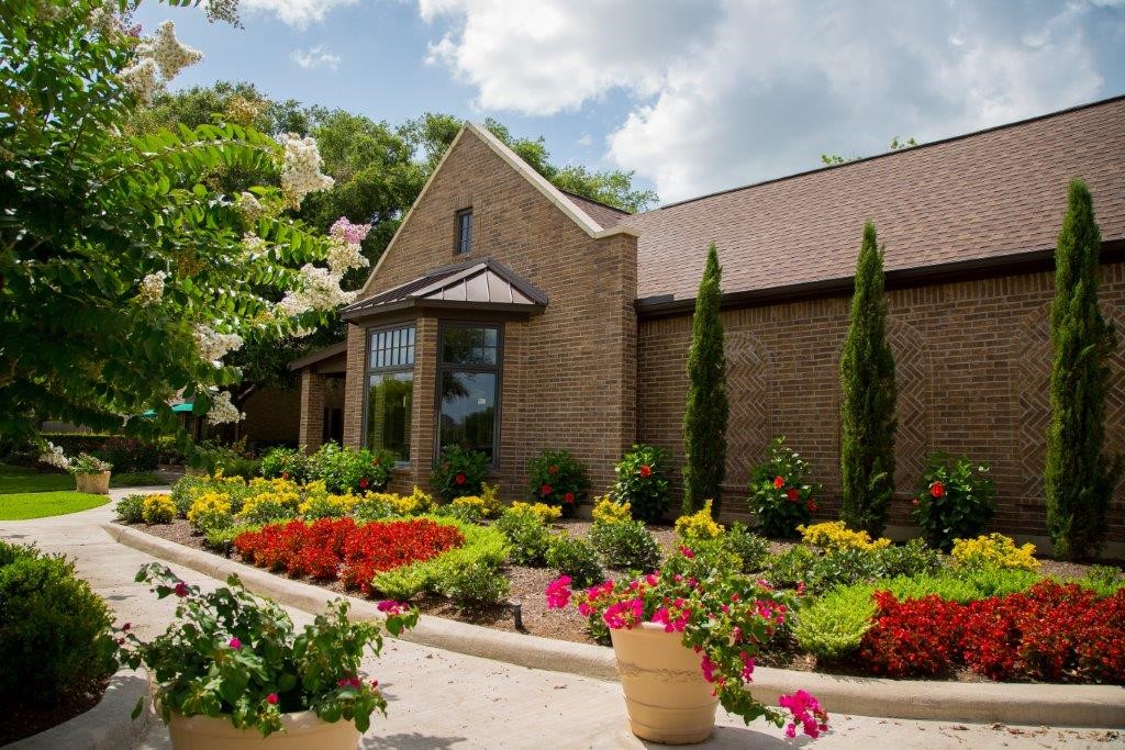 33201 Worthing Lane Fulshear, TX 77441 - Photo 6 of 8 a front view of a house with a yard and flowers