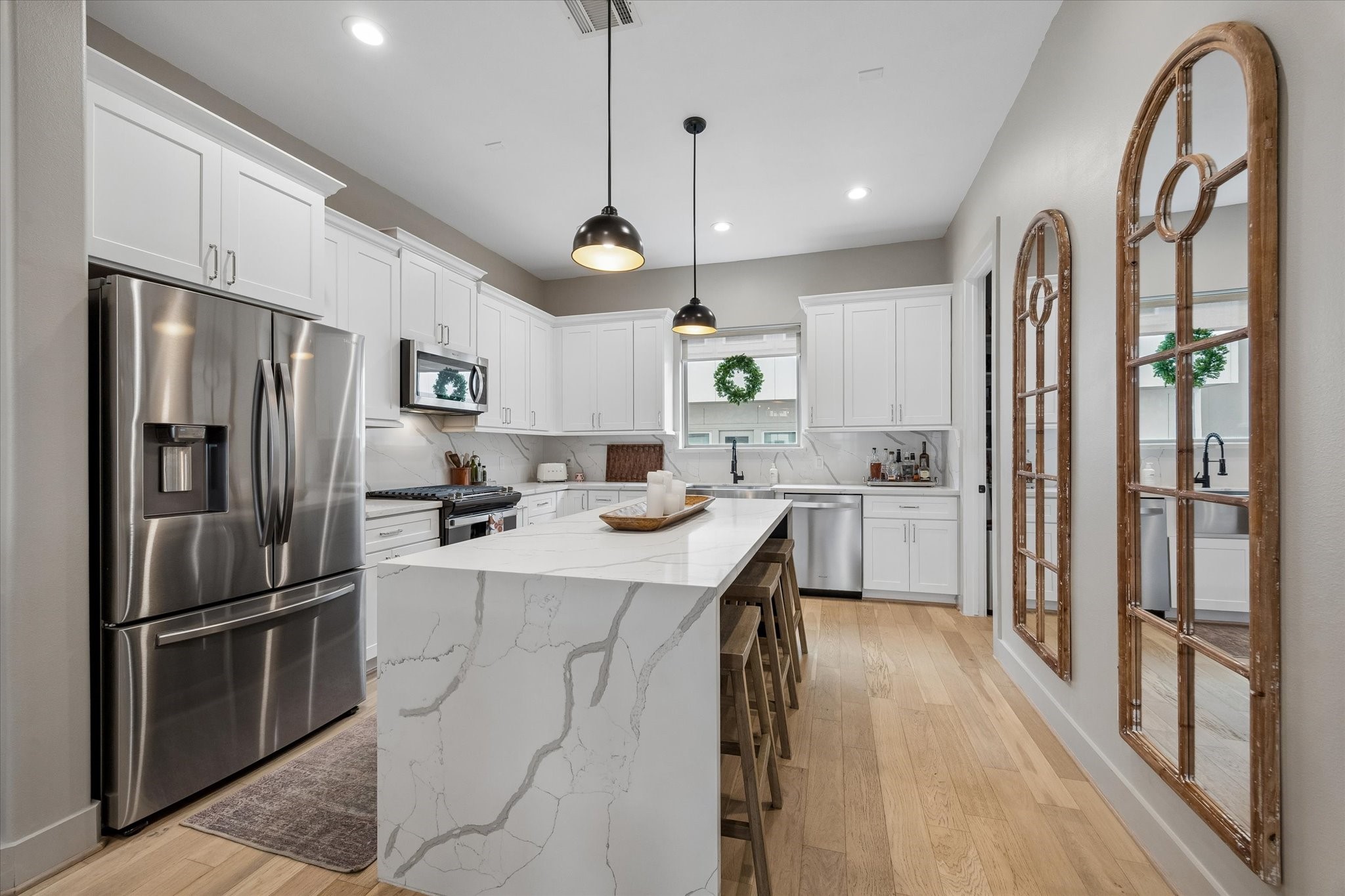 2407 Bevis Street Houston, TX 77008 - Photo 14 of 34 a kitchen with counter top space and stainless steel appliances