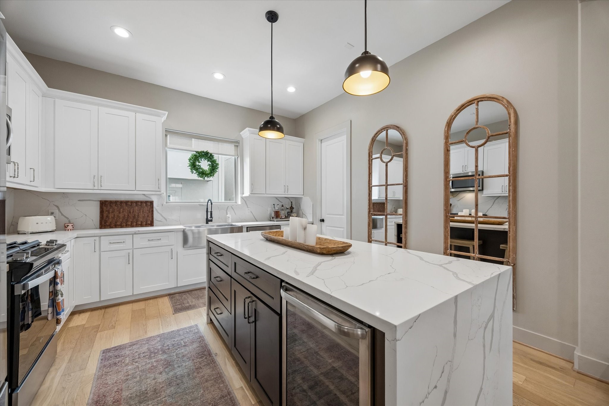 2407 Bevis Street Houston, TX 77008 - Photo 15 of 34 a kitchen with a stove a sink and a refrigerator