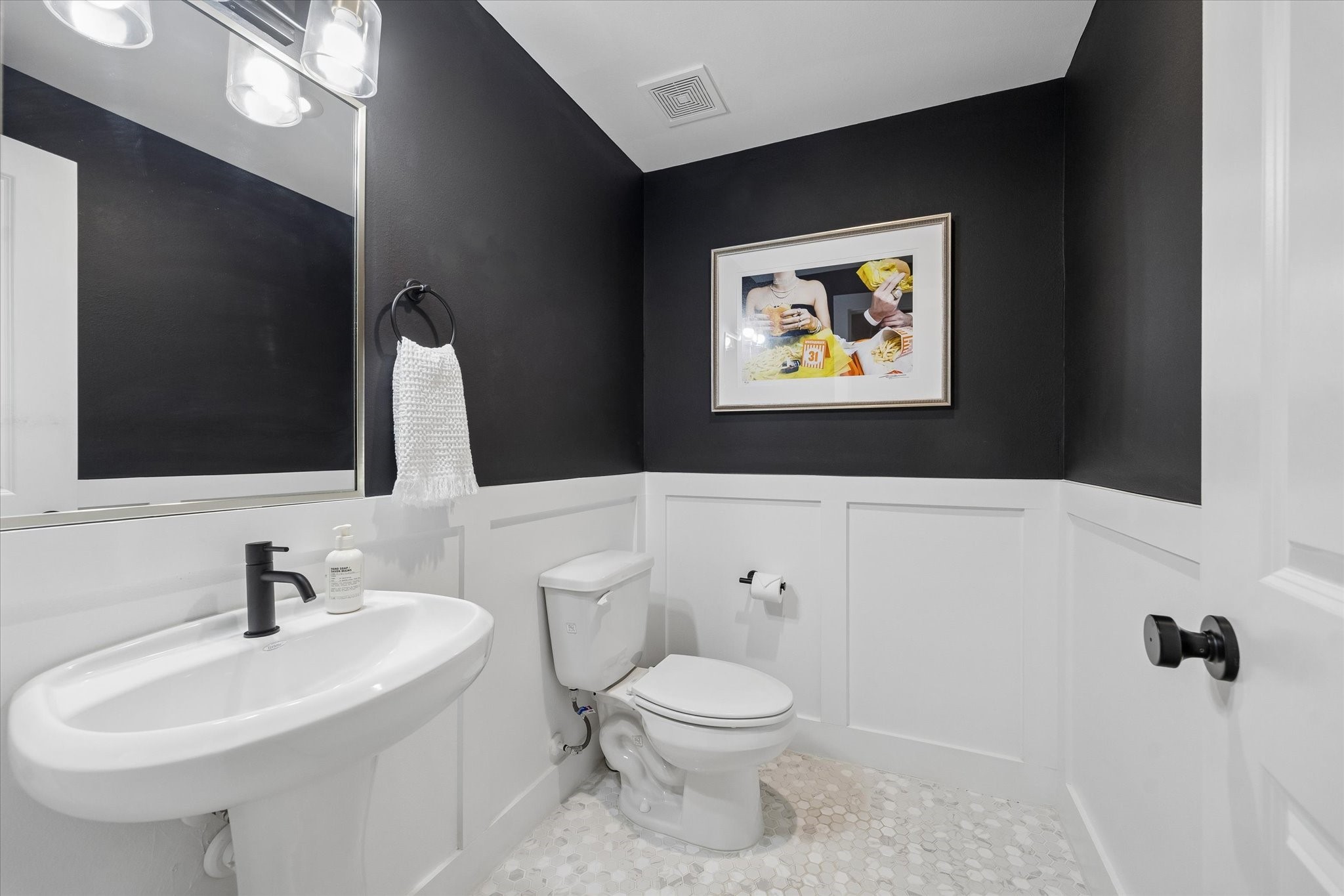 2407 Bevis Street Houston, TX 77008 - Photo 18 of 34 a bathroom with a toilet a sink and mirror