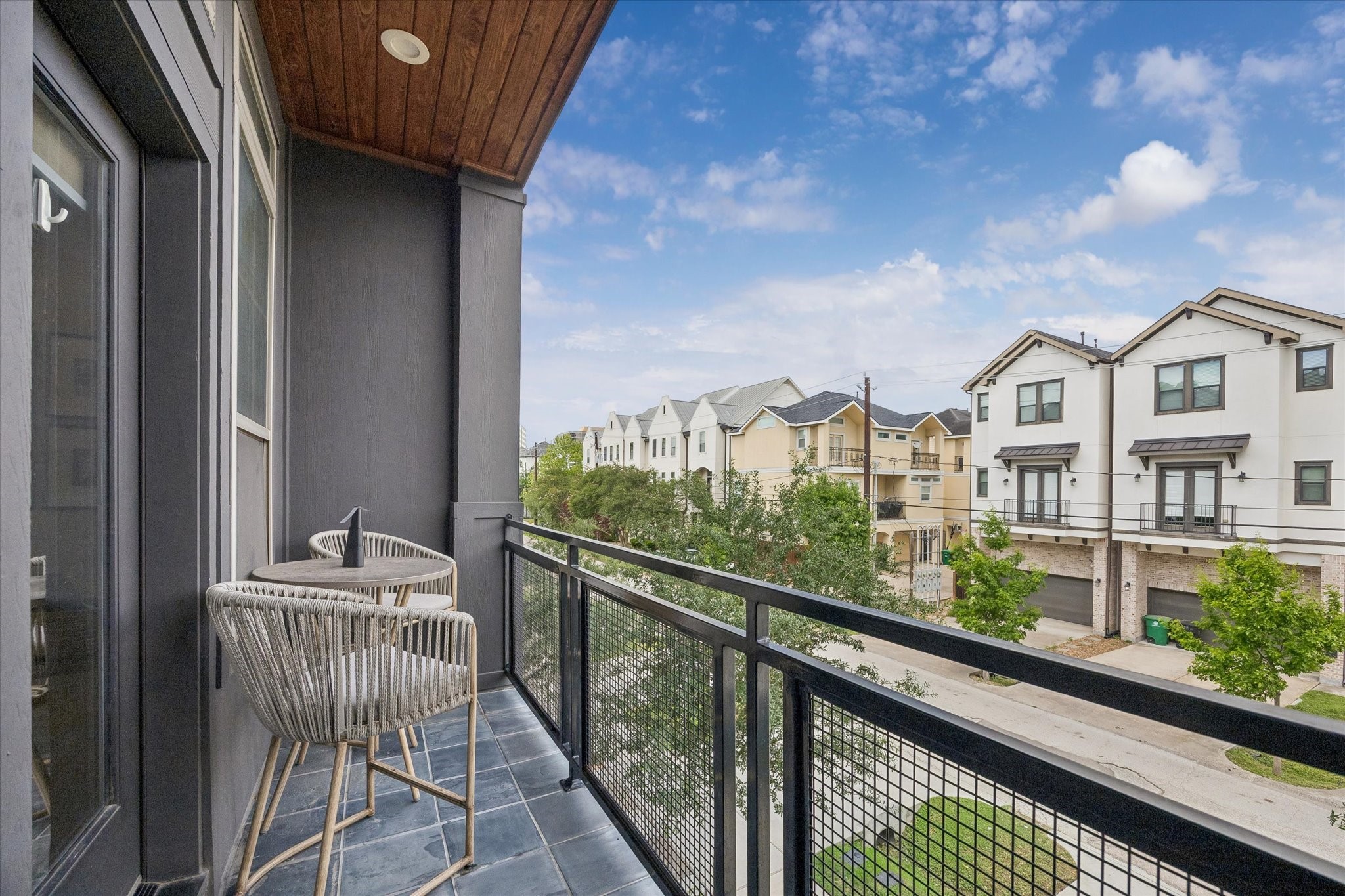2407 Bevis Street Houston, TX 77008 - Photo 19 of 34 a view of a balcony with wooden floor