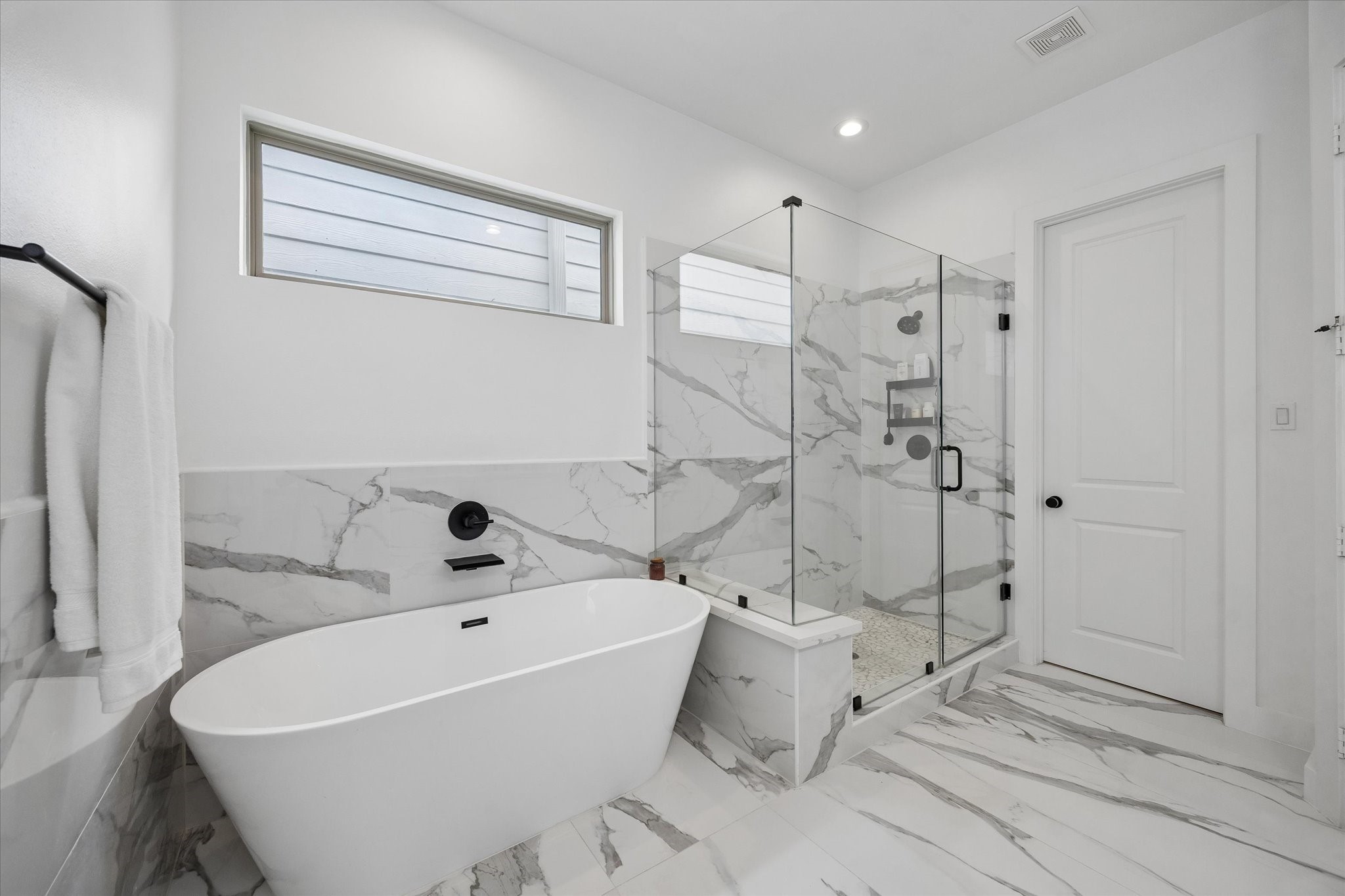 2407 Bevis Street Houston, TX 77008 - Photo 23 of 34 a white bath tub sitting next to a white sink and vanity
