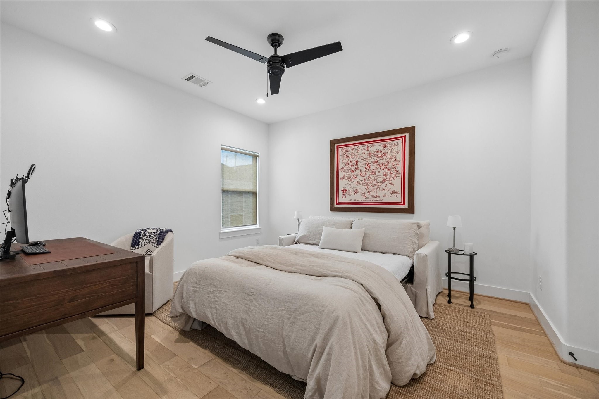 2407 Bevis Street Houston, TX 77008 - Photo 26 of 34 a bedroom with a bed and a desk