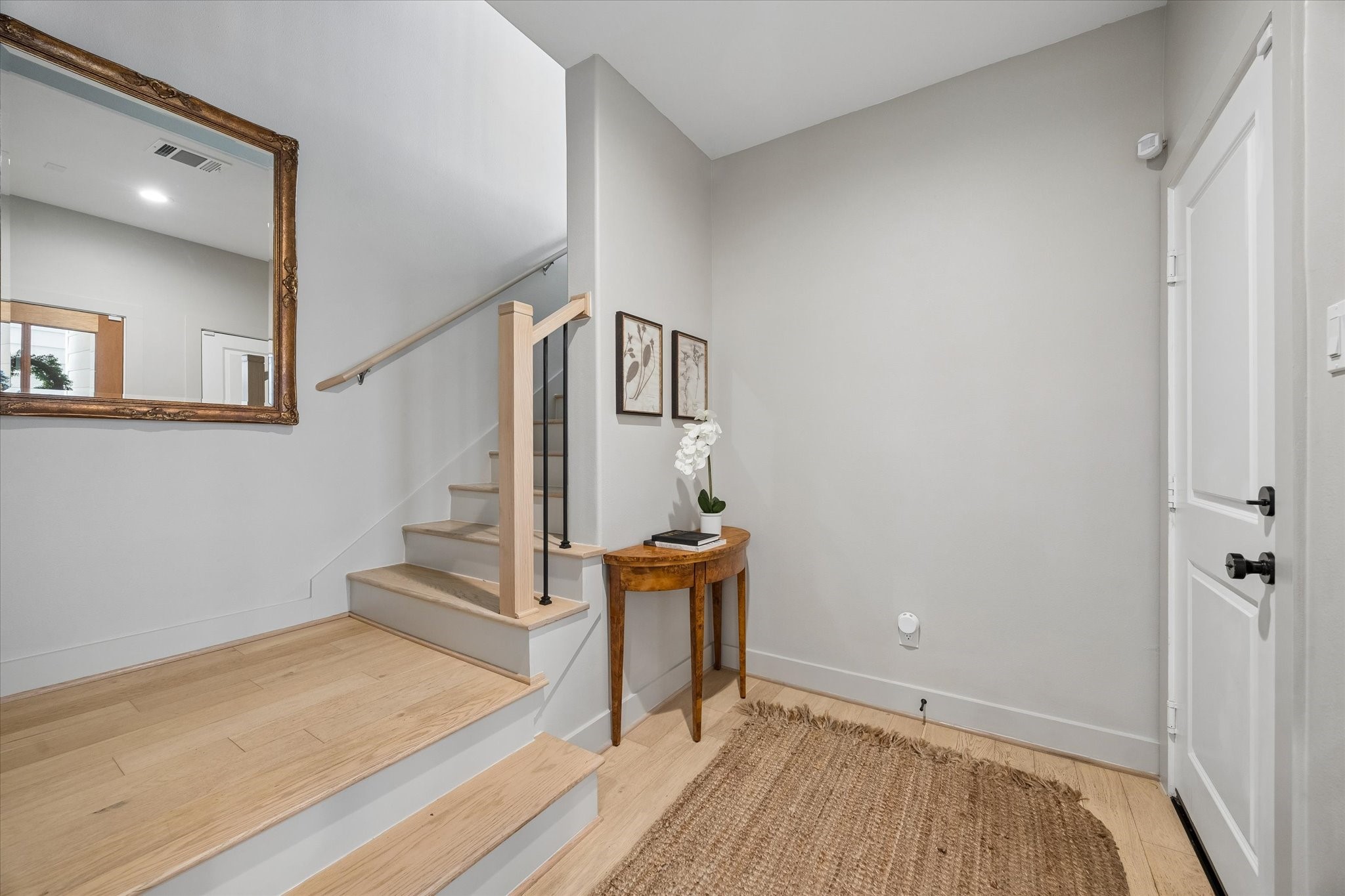 2407 Bevis Street Houston, TX 77008 - Photo 4 of 34 a view of a hallway with wooden floor and staircase
