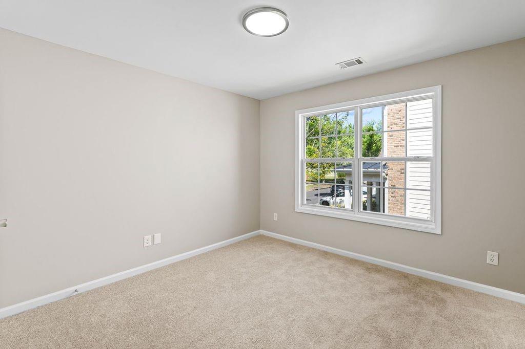 473 Greyhawk Way Fairburn, GA 30213 - Photo 19 of 34 an empty room with a window