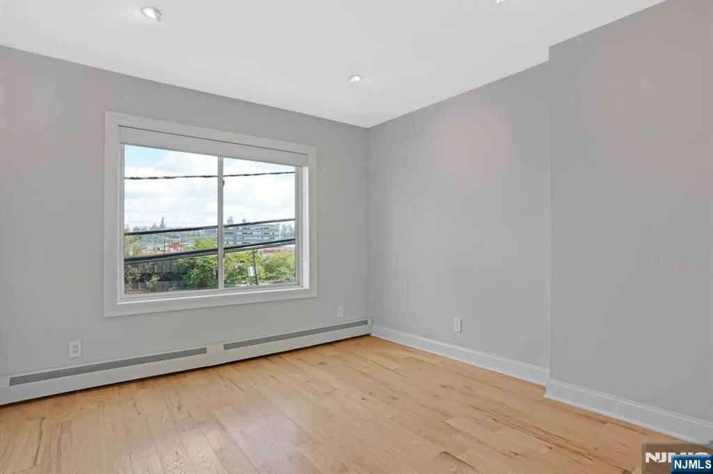 9009 Riverside Place, Unit 1 North Bergen, NJ 07047 - Photo 8 of 12 an empty room with a window