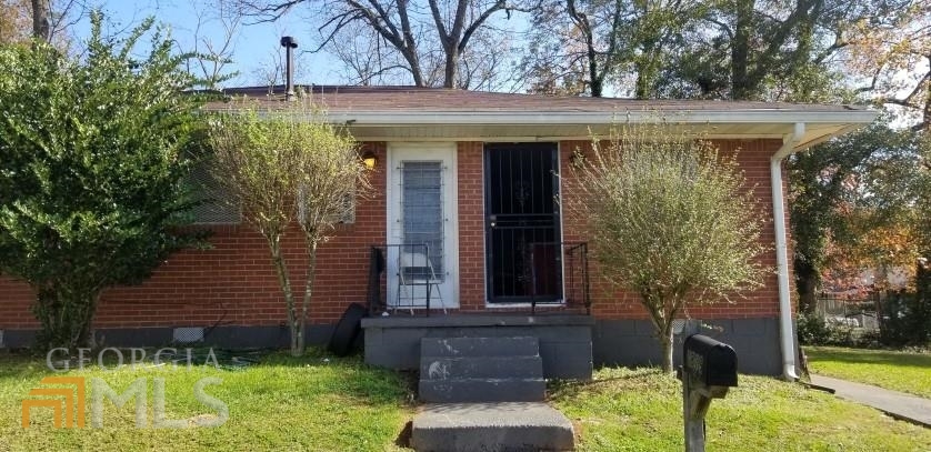1877 Chapman Avenue East Point, GA 30344 - Photo 1 of 1 a view of a house with a yard
