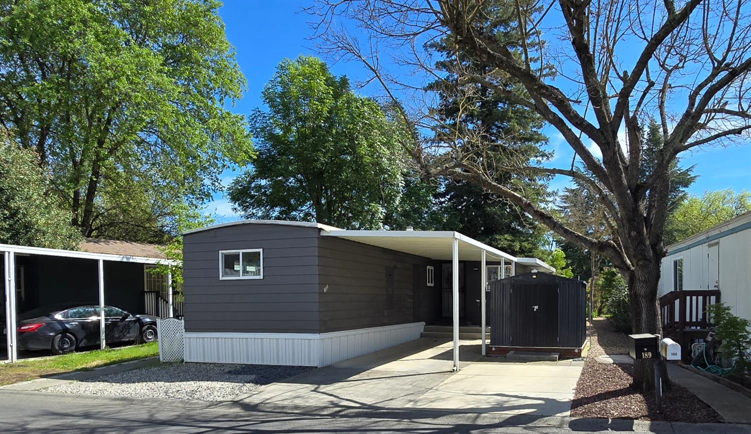 a backyard of a house with trampoline