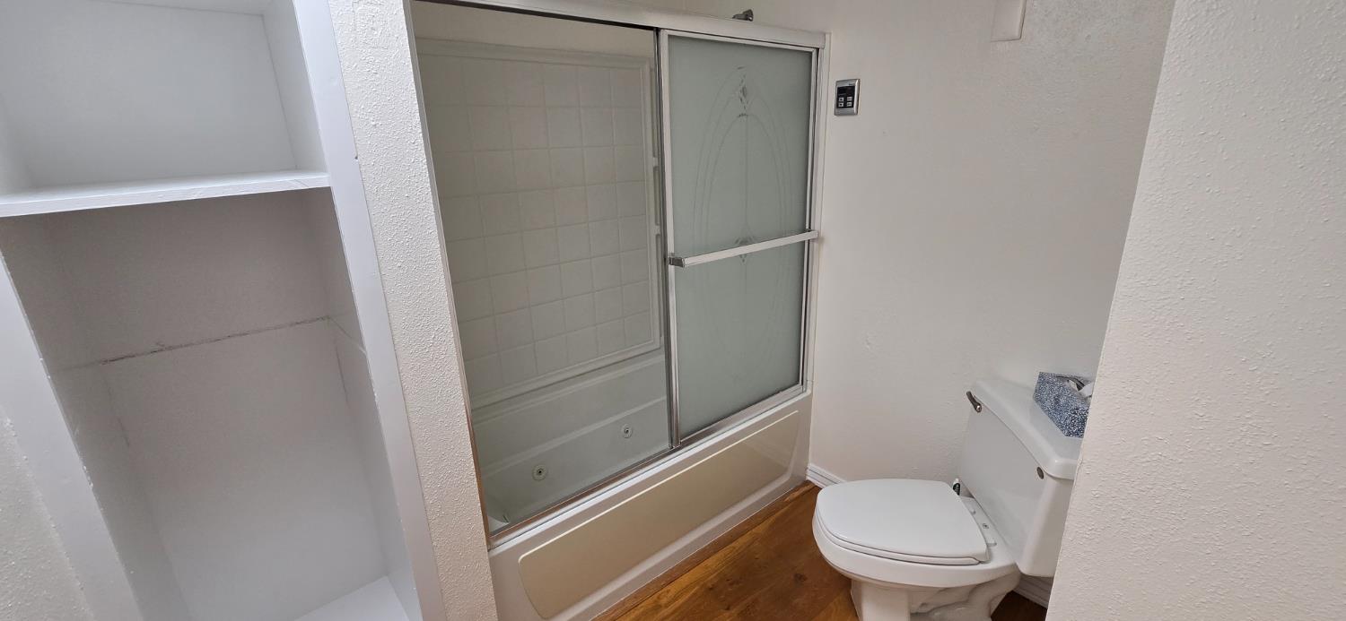 189 Full Circle Davis, CA 95618 - Photo 12 of 29 a white toilet sitting next to a shower