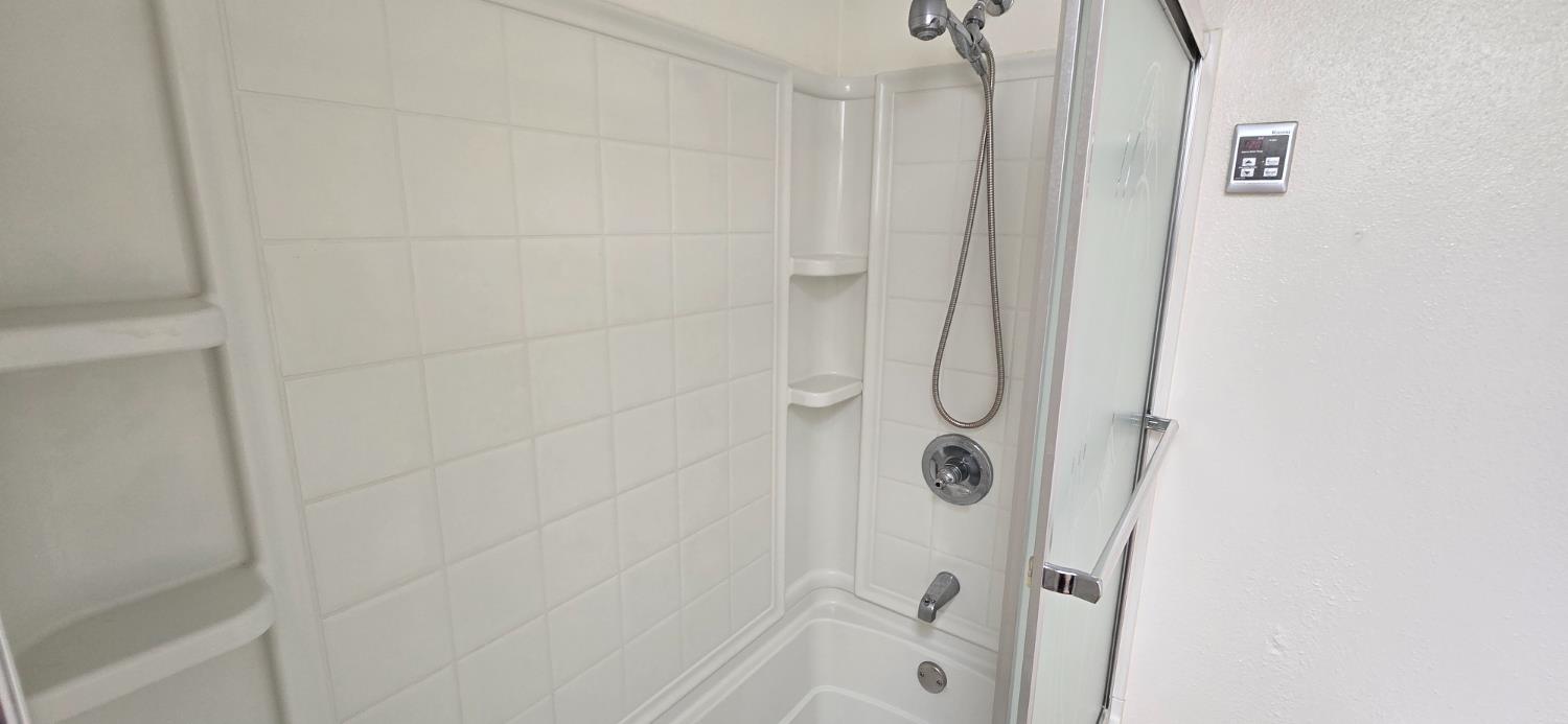 189 Full Circle Davis, CA 95618 - Photo 13 of 29 a bathroom with a glass shower door