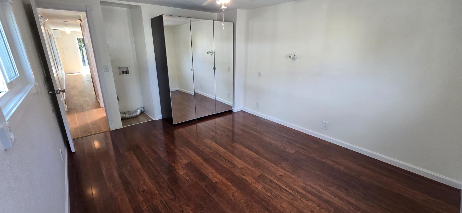 189 Full Circle Davis, CA 95618 - Photo 17 of 29 a view of a hallway with wooden floor